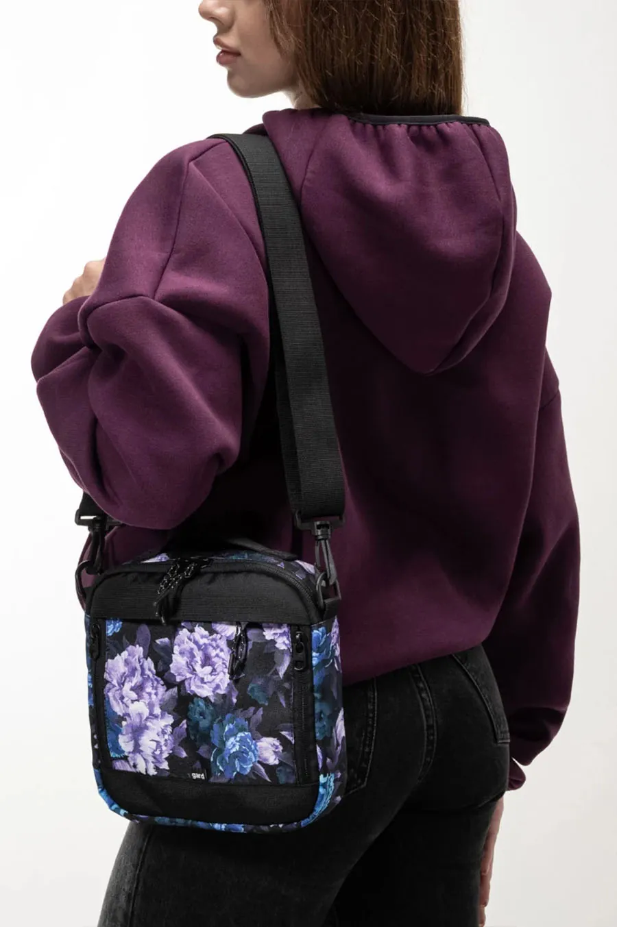 Messenger Gard Bag over Kvadrat's shoulder | purple flowers 1/24 black