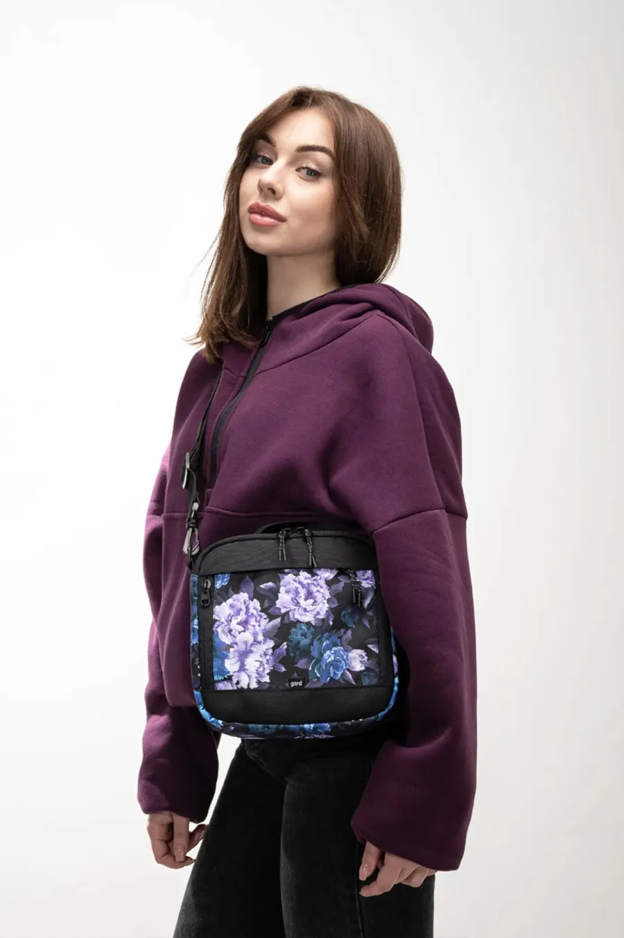 Messenger Gard Bag over Kvadrat's shoulder | purple flowers 1/24 black